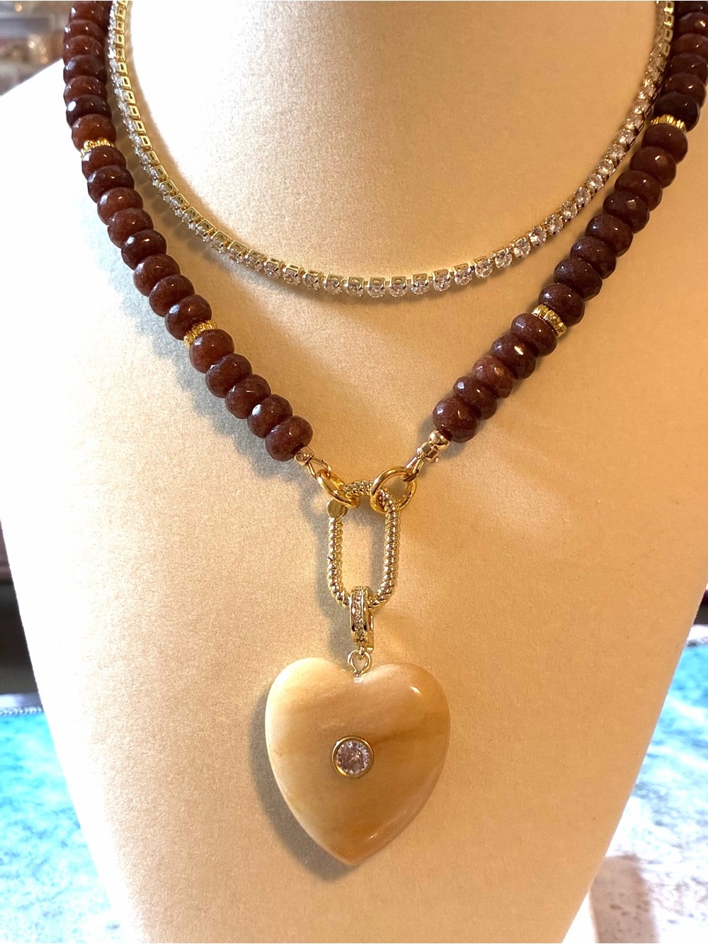 Goldstone Bead Necklace with Cream Heart Pendant and Gold Accents